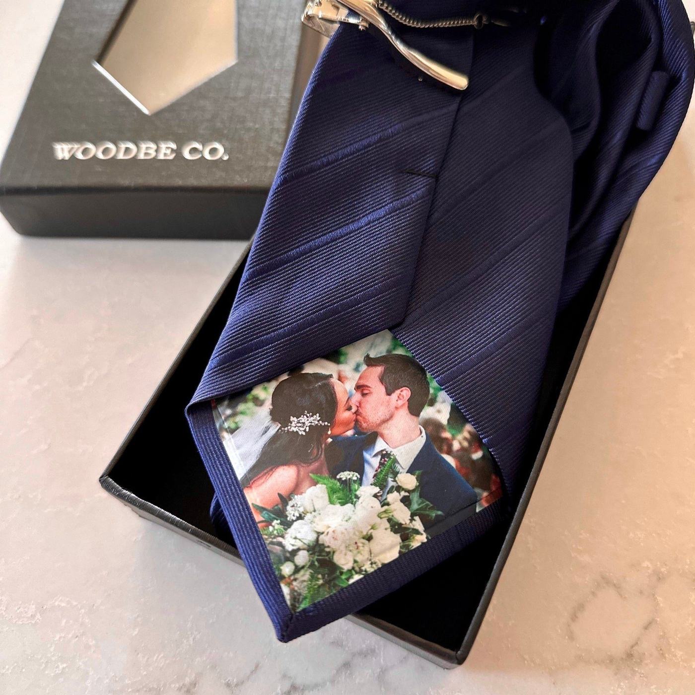 Navy personalized photo silk tie with a wedding photo on the tip, in a Woodbe Co. box